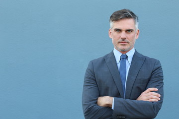 Business magnate with arms crossed 