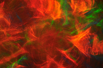 Abstract composition of dark colored smoke in the dark, red, blu