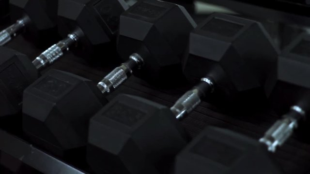 heavy dumbbells in sports gym