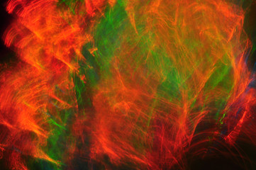 Fototapeta na wymiar Abstract composition of dark colored smoke in the dark, red, blu
