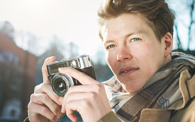 young photographer with analog camera