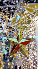 Selective focus gold and silver star decorations with sparkle tr