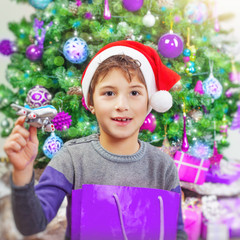 Happy boy near Christmas tree © Anna Om