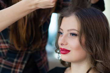 Fototapeta premium Beautiful girl make hairstyle