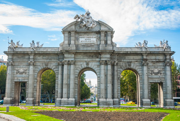 Monument in city of Madrid.   Puerta de Alcalá stands at Plaza de la Independencia in the heart of the city.  It once served to visiting & reigning elite as the gateway to the city. 