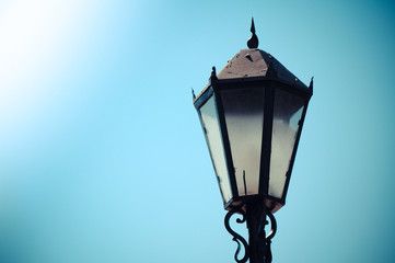 Fototapeta premium Retro street lamp, sky background
