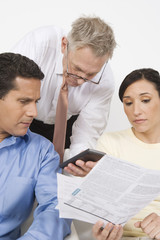 Couple with a financial planner discussing investment plans