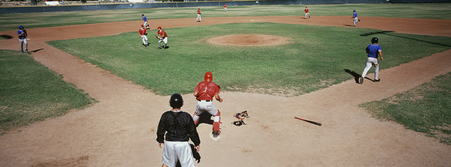 Baseball tournament match between two teams on field