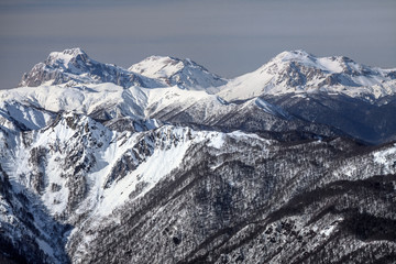 Fototapeta na wymiar Beautiful snowy mountain peaks scenic winter landscape
