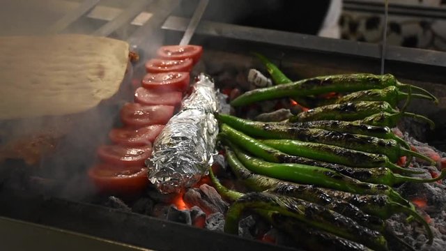 Preparation of Adana kebab, Shish kebab and liver kebab cooked on the barbecue in a kebab shop