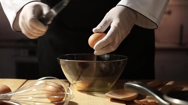 Fresh egg in kitchen and cook hands 