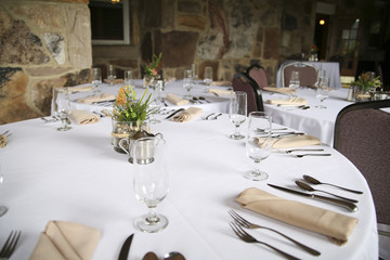 Wedding Reception Tables in Front of Brick Walls