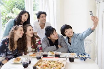 Fototapeta premium Happy friends taking photograph