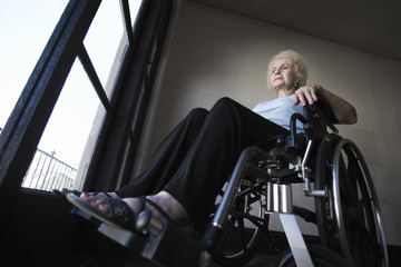 Fototapeta na wymiar Low angle view of a senior woman in wheelchair