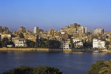 Obraz premium River Nile and colonial mansions in foreground Gezira island Cairo. Egypt