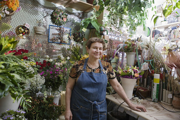 Portrait of a confident female florist in shop