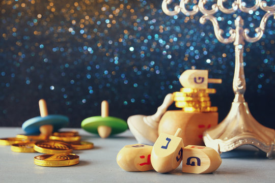 Image of jewish holiday Hanukkah with wooden dreidels
