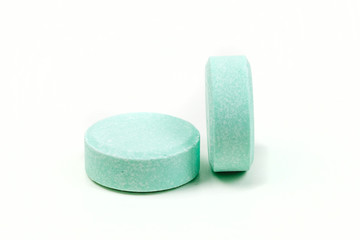 Minty antacid tablets isolated on white background