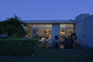 Exterior shot of a modern house against clear sky at dusk