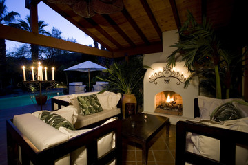 View of an furniture around lit fireplace in an old fashioned living room