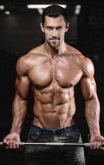 Fototapeta premium man with weight training in gym equipment sport club