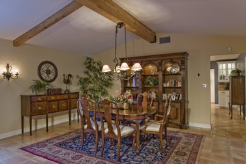 Chairs around dining table in an old fashioned house