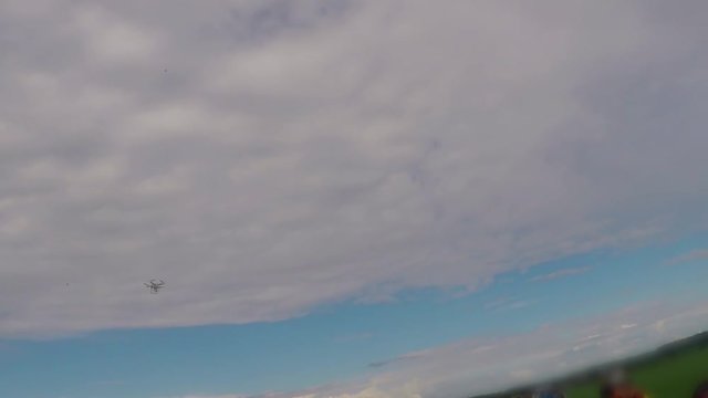 Drone with camera  flying in sky