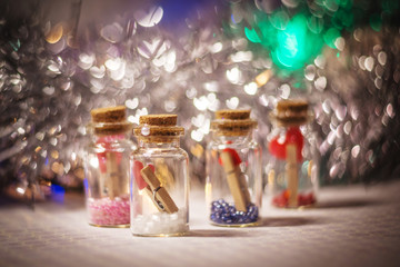 decorative bottles with little hearts on the clothespins