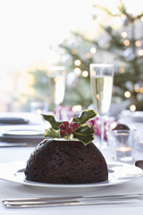 Fototapeta na wymiar Closeup of Christmas pudding with holly on top