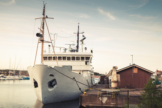 Old white ship moored in port of Kotka
