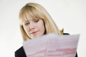 Serious financial advisor studying paperwork