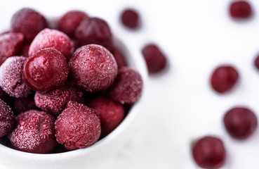 Frozen sweet cherries isolated on a white background. Closeup