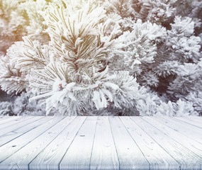 Wood table top on winter background, use for display of your pro