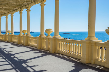 Oceanfront sea promenade pergola walkway with pillars, Foz Porto, Portugal