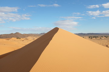 Fototapeta na wymiar Sahara Desert Landscape with Dune and Mountains in Morocco