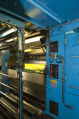 Closeup of printing machine working part with light