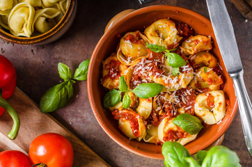 Homemade tortellini with tomato sauce