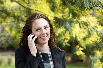 Close-up of young woman talking on cell phone