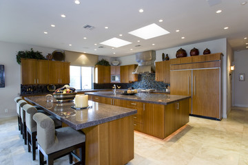 View of chairs at counter in the spacious and luxury kitchen