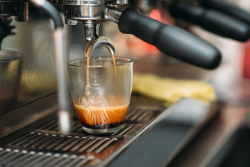 Preparation of drink in the coffee machine.