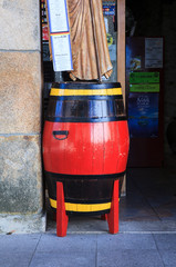 SARRIA, SPAIN - AUGUST, 11: Red barrel next to the entrance of a pub on August 11, 2016