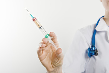 Closeup of doctor with syringe isolated over white background