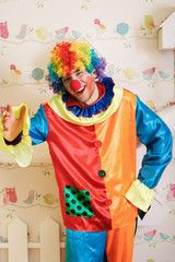 Serious clown in funny costume.