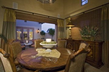 Closeup of chairs around dining table in an old fashioned house