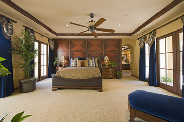 Spacious and luxury bedroom interior with ceiling fan - Powered by Adobe