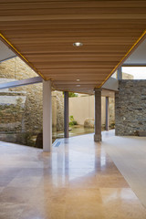 Pillared walkway of a modern house in the garden