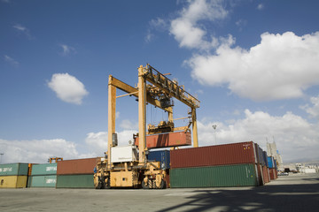 Cranes and cargo containers against the sky at dock in Limassol Cyprus