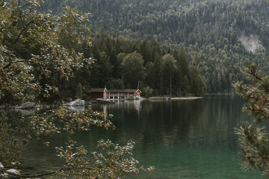 Cozy Boat House at a lake in the german Mountains framed by forest