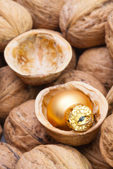 Fototapeta na wymiar Christmas decorations in the shell of walnuts.