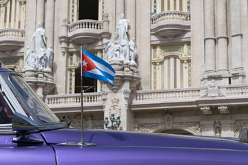 Cuban flag on a classic car in Old Havana, Cuba 